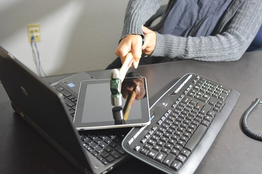 Computer technology being smashed